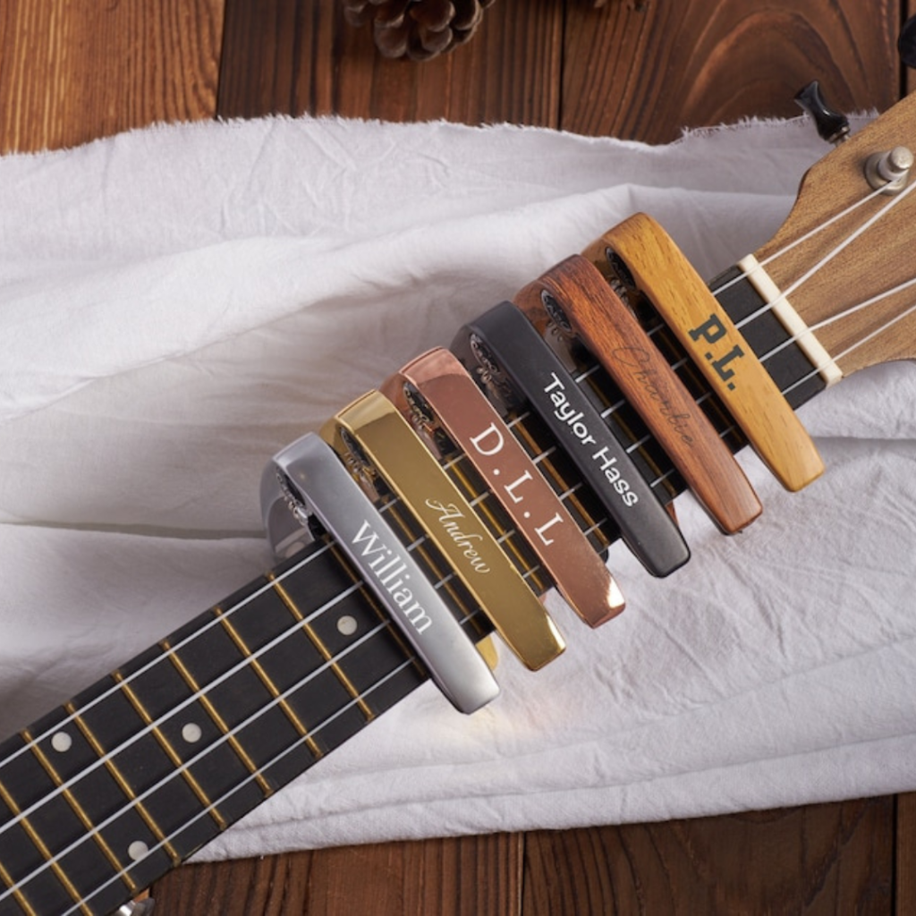 Photo of Custom Wooden Guitar Capos By CraftsByAden