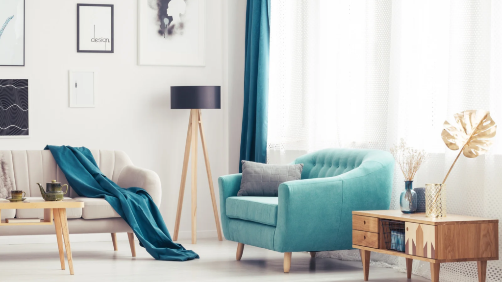 Stock photo from Canva of a blue armchair in a white themed living room