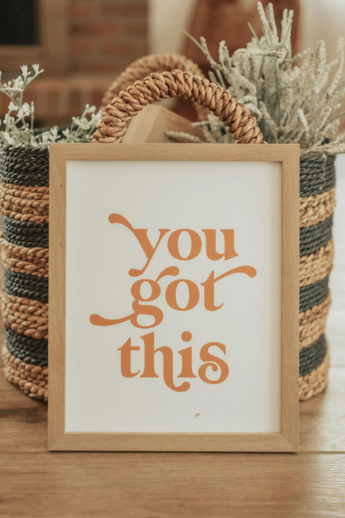 Stock photo from Canva of a frame with Motivational Quotes on a print