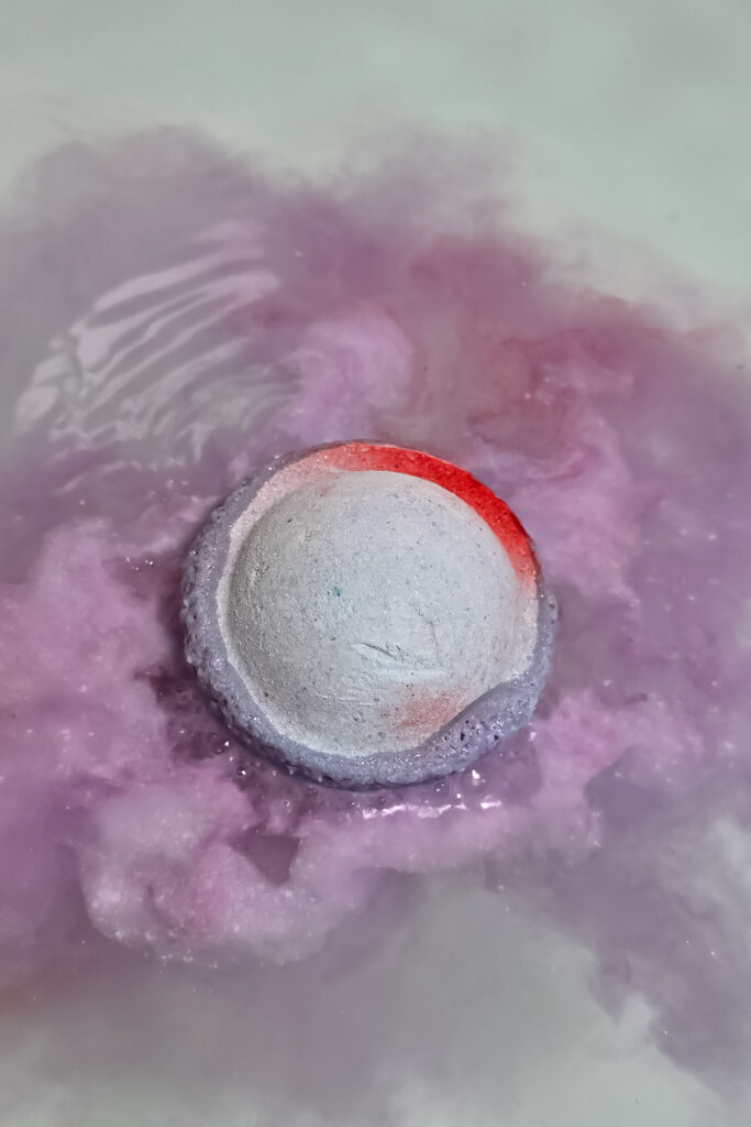 Close up photo of Space Girl Bath Bomb from Lush in water